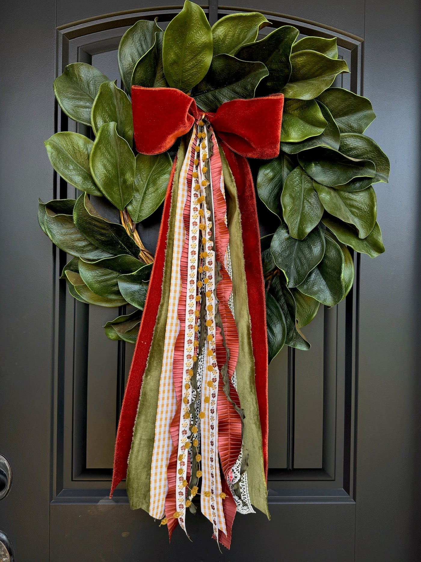 Applewood Charm Designer Bow on a fall front door wreath with autumn foliage