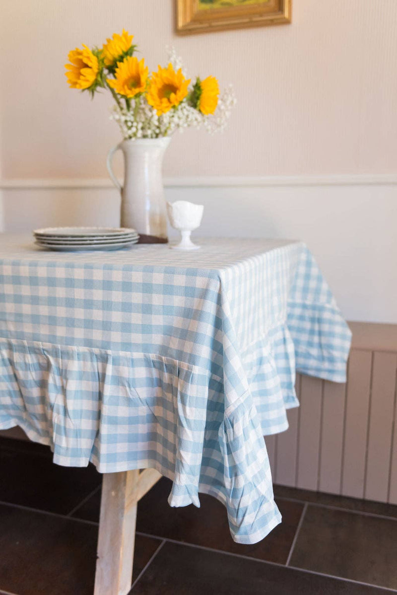 Bluebell Gingham Ruffle Tablecloth styled for outdoor summer entertaining on a dining table