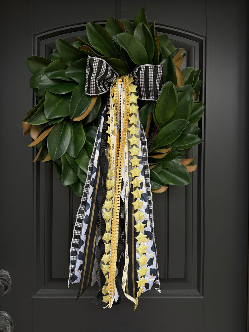 Graduation Designer Bow in black, gold, and ivory on front door wreath by House of Turnberry
