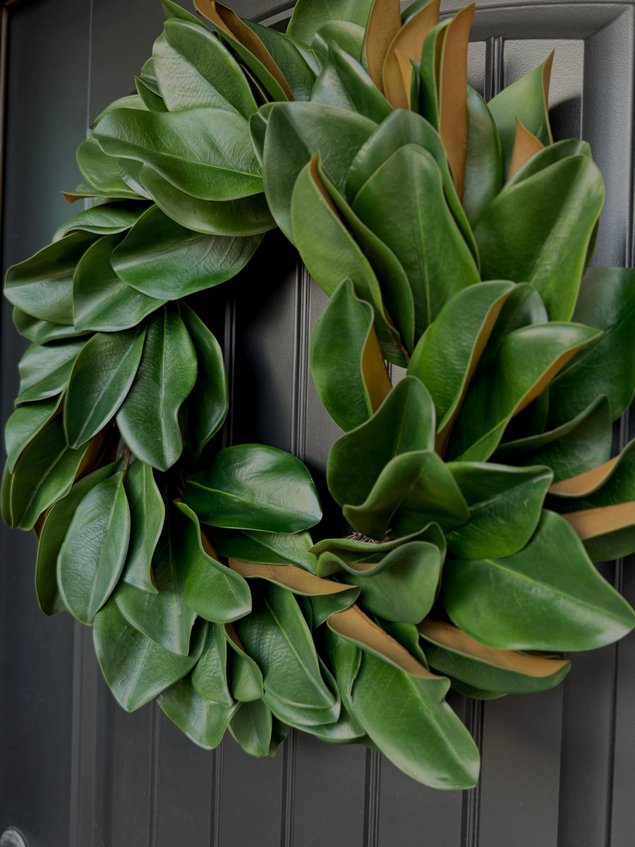 Turnberry Magnolia Wreath hanging on a front door
