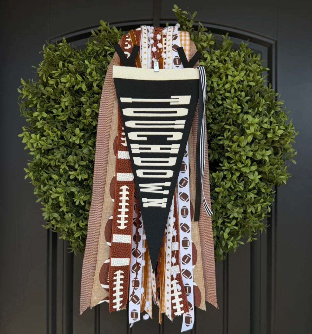 Touchdown football ribbon set displayed on a green wreath
